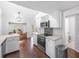Bright kitchen with white cabinets, stainless steel appliances, and an adjacent dining area at 226 Ringwood Dr, Winter Springs, FL 32708
