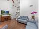 Inviting living room with a staircase, hardwood floors, and a media center at 226 Ringwood Dr, Winter Springs, FL 32708