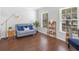 Bright living room with hardwood floors, stylish decor, and plenty of natural light from the windows at 226 Ringwood Dr, Winter Springs, FL 32708