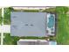 Aerial view of a house showcasing the roof, pool, and backyard space within a residential area at 2263 Wyndham Palms Way, Kissimmee, FL 34747