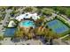 Aerial view showcasing community amenities including a pool, tennis courts, and recreational areas at 2263 Wyndham Palms Way, Kissimmee, FL 34747
