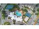 Community aerial view showing a large pool, basketball court, tennis courts, and ample parking at 2263 Wyndham Palms Way, Kissimmee, FL 34747