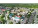 Aerial view of community pool, tennis courts, and surrounding residential area at 2263 Wyndham Palms Way, Kissimmee, FL 34747
