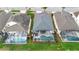 Aerial view of property showcasing a private pool, screened-in patio, and lush backyard at 2263 Wyndham Palms Way, Kissimmee, FL 34747