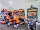 Arcade room showcasing a variety of engaging games for ultimate home entertainment at 2263 Wyndham Palms Way, Kissimmee, FL 34747