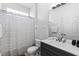 Bathroom features a walk-in shower, single sink vanity with light countertops, and modern fixtures at 2263 Wyndham Palms Way, Kissimmee, FL 34747