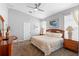 This spacious bedroom features carpet, soft lighting, and neutral paint at 2263 Wyndham Palms Way, Kissimmee, FL 34747