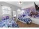 bedroom featuring dual beds with cartoon-themed decor at 2263 Wyndham Palms Way, Kissimmee, FL 34747