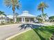 A bright and airy clubhouse exterior featuring manicured landscaping and a welcoming entrance at 2263 Wyndham Palms Way, Kissimmee, FL 34747