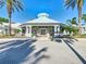 Stunning clubhouse framed by palm trees offering a beautiful gathering space at 2263 Wyndham Palms Way, Kissimmee, FL 34747