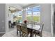 The dining area is open to the screened-in lanai and the pool beyond at 2263 Wyndham Palms Way, Kissimmee, FL 34747
