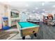 This game room features a billiard table, ping pong, arcade games, and murals, making it perfect for entertainment and fun at 2263 Wyndham Palms Way, Kissimmee, FL 34747