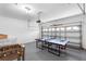 The spacious garage includes a ping pong table and foosball table for recreation at 2263 Wyndham Palms Way, Kissimmee, FL 34747