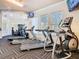 A well-equipped fitness center with treadmills, elliptical machines, and weight training equipment at 2263 Wyndham Palms Way, Kissimmee, FL 34747