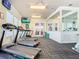 Well-equipped gym featuring treadmills and a mirrored wall, perfect for staying active and healthy at 2263 Wyndham Palms Way, Kissimmee, FL 34747