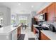 Bright and airy kitchen with modern appliances and a view of the dining area and pool at 2263 Wyndham Palms Way, Kissimmee, FL 34747