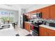 Well-equipped kitchen featuring stainless steel appliances, ample counter space, and modern cabinetry at 2263 Wyndham Palms Way, Kissimmee, FL 34747