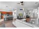 Open-concept living space with modern furnishings and seamless flow to the kitchen area at 2263 Wyndham Palms Way, Kissimmee, FL 34747