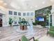 Beautiful clubhouse lobby with a tropical mural, providing a relaxing and elegant ambiance at 2263 Wyndham Palms Way, Kissimmee, FL 34747