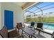 Relaxing screened-in patio area overlooking the pool and backyard at 2263 Wyndham Palms Way, Kissimmee, FL 34747