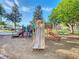 A colorful playground with slides and climbing structures provides a fun and safe environment for children to play and explore at 2263 Wyndham Palms Way, Kissimmee, FL 34747