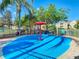 A splash pad with a central mushroom fountain provides a refreshing and fun water play area for  at 2263 Wyndham Palms Way, Kissimmee, FL 34747