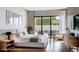Spacious bedroom featuring hardwood floors, a king-size bed, and sliding glass doors to the backyard at 2612 Musselwhite Ave, Orlando, FL 32804