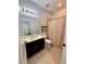 Bathroom featuring a vanity with sink and a shower with patterned curtain at 2656 River Landing Dr, Sanford, FL 32771