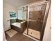 Bathroom featuring a bathtub and separate glass enclosed shower at 2656 River Landing Dr, Sanford, FL 32771
