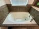 Close up of a soaking tub with tile backsplash at 2656 River Landing Dr, Sanford, FL 32771