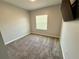 Neutral bedroom with carpet flooring and a window providing natural light at 2656 River Landing Dr, Sanford, FL 32771