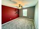 Spacious bedroom with a ceiling fan, large window, and neutral carpeting at 2656 River Landing Dr, Sanford, FL 32771