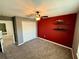 Bedroom with a ceiling fan, plush carpeting, and a modern accent wall at 2656 River Landing Dr, Sanford, FL 32771