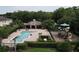 Aerial shot of a community pool and recreational area featuring a pool, playground, and lounge area at 2656 River Landing Dr, Sanford, FL 32771