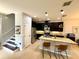 Modern kitchen with stainless steel appliances, granite countertops, and a stylish island with bar seating at 2656 River Landing Dr, Sanford, FL 32771