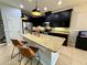 Beautiful kitchen with stainless steel appliances, granite countertops and dark cabinets at 2656 River Landing Dr, Sanford, FL 32771
