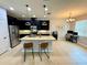 Open-concept kitchen featuring granite countertops, stainless steel appliances, and a kitchen island with bar stools at 2656 River Landing Dr, Sanford, FL 32771