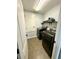 Laundry room with modern washer and dryer units and ample storage space at 2656 River Landing Dr, Sanford, FL 32771