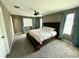 Spacious main bedroom with carpeting, large windows, and a ceiling fan at 2656 River Landing Dr, Sanford, FL 32771
