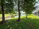 Picturesque pond view framed by trees featuring a fountain and a well maintained lawn at 2656 River Landing Dr, Sanford, FL 32771