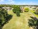 Aerial view of property nestled amidst trees and greenery, offering privacy and a connection with nature at 2726 La Alameda Ave, Kissimmee, FL 34746