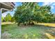 Backyard space featuring manicured lawn and mature trees providing plenty of shade at 2726 La Alameda Ave, Kissimmee, FL 34746