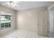 Bright bedroom featuring a ceiling fan, window with blinds, and easy access to other rooms at 2726 La Alameda Ave, Kissimmee, FL 34746