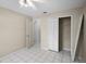 This cozy bedroom features neutral paint, ceiling fan, and an organized closet at 2726 La Alameda Ave, Kissimmee, FL 34746