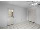 Bedroom featuring tile floors, a ceiling fan, a closet, and access to the exterior of the home at 2726 La Alameda Ave, Kissimmee, FL 34746
