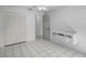 Bedroom with tile floors, a closet, modern shelving, and a ceiling fan at 2726 La Alameda Ave, Kissimmee, FL 34746