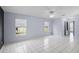 Large bedroom with tile flooring, ceiling fan, and ample natural light from the windows at 2726 La Alameda Ave, Kissimmee, FL 34746