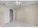 This bedroom has tile floors, a ceiling fan, and a closet at 2726 La Alameda Ave, Kissimmee, FL 34746