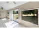 Sunroom with white tile floors and a view of the green lawn at 2726 La Alameda Ave, Kissimmee, FL 34746