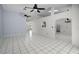 Expansive living room boasts tile flooring, and ceiling fans, enhancing the room's appeal at 2726 La Alameda Ave, Kissimmee, FL 34746